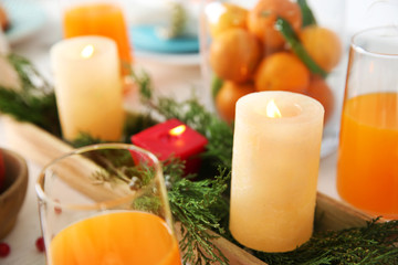 Table setting with candles and fruits, closeup