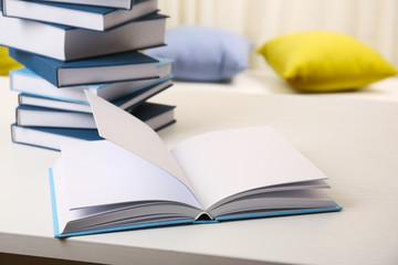 Books on white wooden table