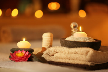 Natural treatments and alight candles in spa salon