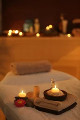 Raamstickers Natural treatments and alight candles in spa salon © Africa Studio