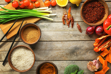 Rice and other products on wooden table