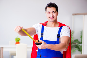 Superhero repairman with tools in repair concept