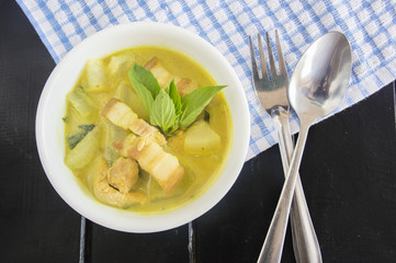 Green pork curry with old wooden background , Thai cuisine