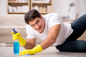 Man husband cleaning the house helping wife