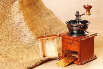 Classic style of coffee grinder in the scene appear the gold bar also.