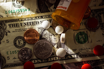 Pills and money prescription and medication cost for health care
