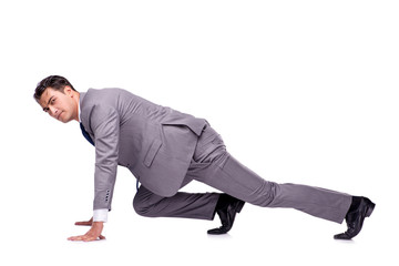 Businessman on start ready for running isolated on white