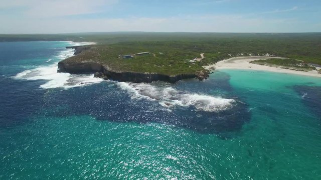 Forward flight over ocean towards coastline with breaking waves near Hanson Bay.  Kangaroo Island, South Australia