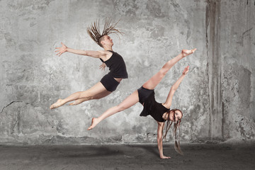 Young couple of modern ballet dancers