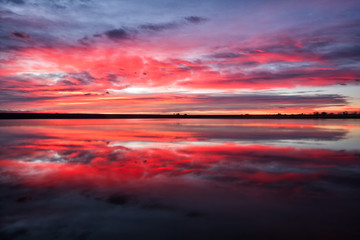 Colorful sunrise reflection on a lake