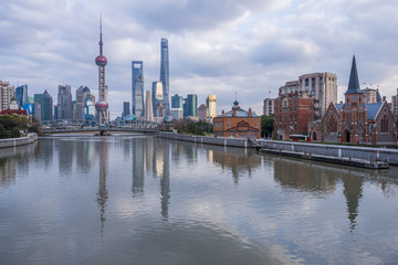 Fototapeta na wymiar River And Modern Buildings Against Sky in Shanghai,China.