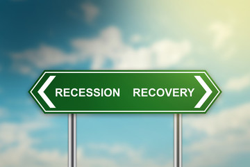 recession and recovery on green road sign