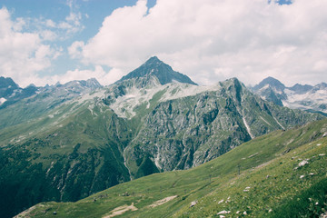 Mountain summer landscape with forest and high peaks. Caucasus.