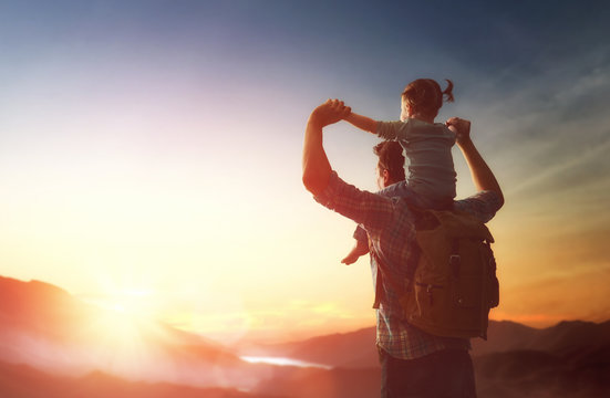 Father and baby at sunset
