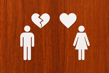 Paper woman with heart and man with broken one
