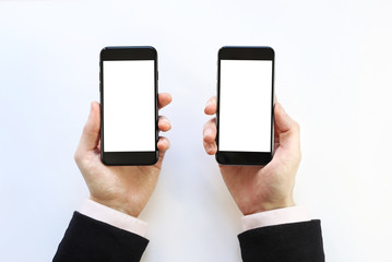  two smartphones in the hands. on a white background 