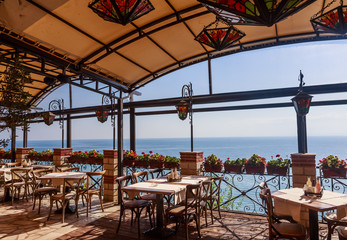 The interior of the restaurant overlooking the sea