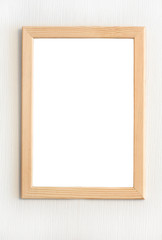 Light  wooden frame for picture hanging on white wall