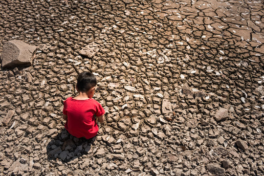 Children be sad, ground dry concept drought.
