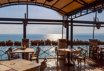 The interior of the restaurant overlooking the sea