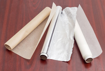 Rolls of parchment paper and aluminum foil for household use