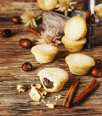 small round Christmas cakes with nuts and cinnamon, space for text