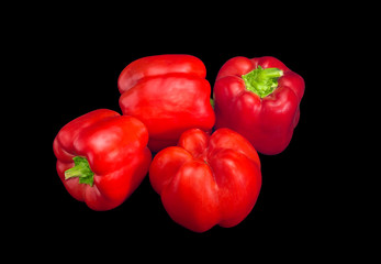 Red bell peppers on a dark background