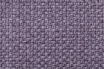 Violet textile background with checkered pattern, closeup. Structure of the fabric macro.