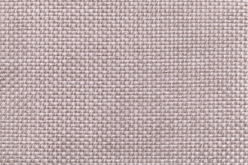 Light beige textile background with checkered pattern, closeup. Structure of the fabric macro.