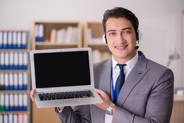 Handsome customer service clerk with headset 