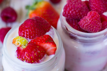 Two jars of home berry yogurt