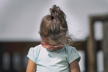 Little girl looking down