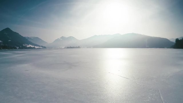 Scenic view of frozen lake schliersee, bavaria, germany, near munich, against the alps