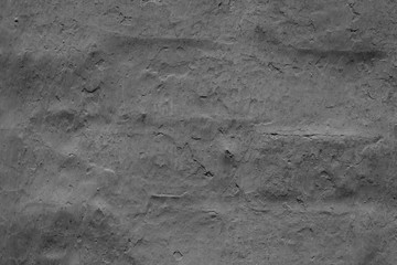 Wall fragment with scratches and cracks