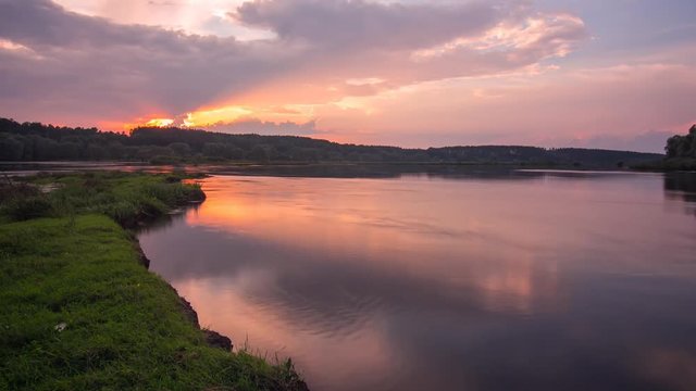 Landscape time lapse of beautiful sunset sky over Desna river in Ukraine.