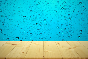 Empty wooden table space platform and water drop background for
