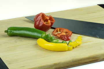 Sliced chili peppers on cutting board