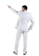 businessman in white suit pointing at wall. rear view.