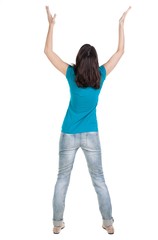 Back view of  joyful woman celebrating victory hands up