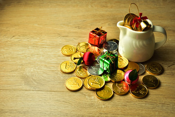 gold coin with a bowl on wooden background, christmas background