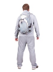 Fototapeta premium Back view of man with backpack looking up.