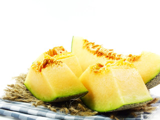 juicy honeydew melon on a wooden table background