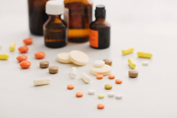 Composition of medicine bottles and pills  on white background
