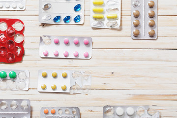 medical pills, antibiotics on a wooden background