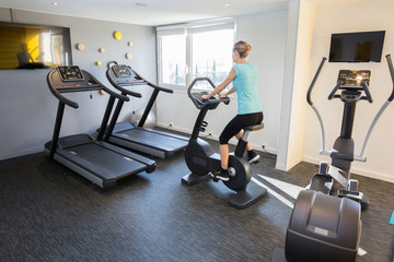 woman exercising in gym room