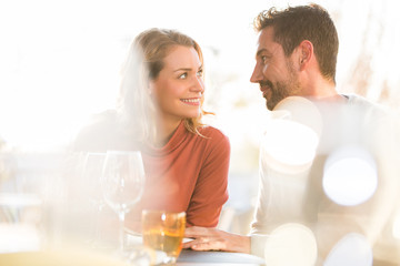 Young couple dating in restaurant