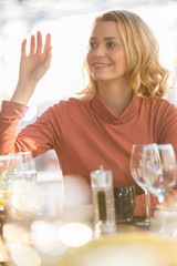 beautiful woman sitting in a restaurant