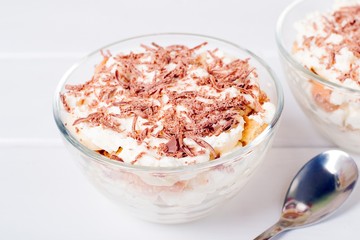 Cheesecake dessert in glass jar on wooden background. Healthy dessert. Healthy food concept.