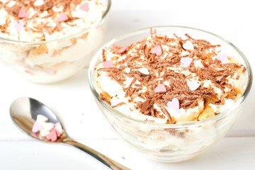 Cheesecake dessert in glass jar on wooden background. Healthy dessert. Healthy food concept.