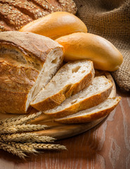 bread and wheat on the wooden